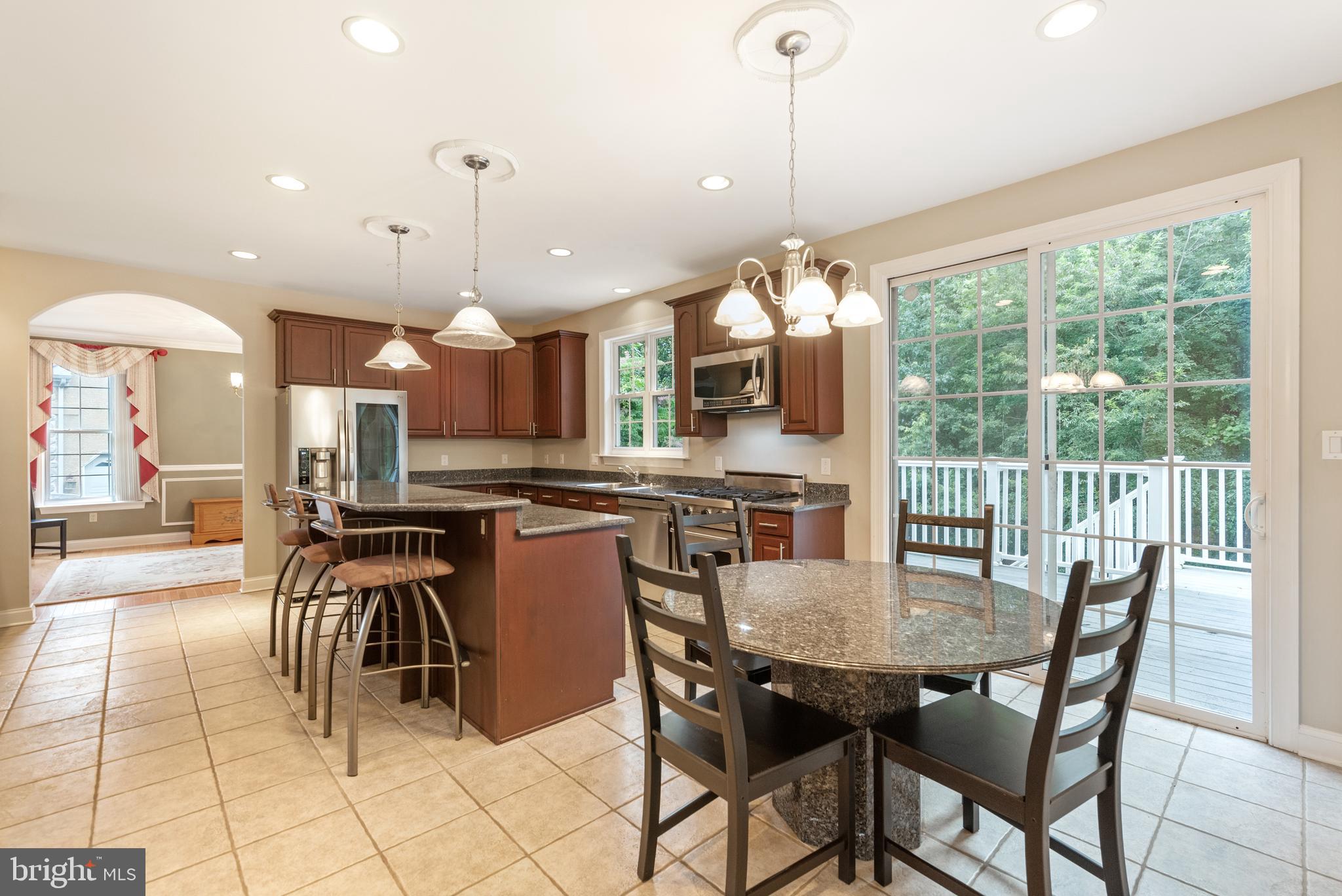746 Kelli Lane Springfield, PA 19064 - Photo 6 of 35 Deck off the kitchen area enjoys wooded views