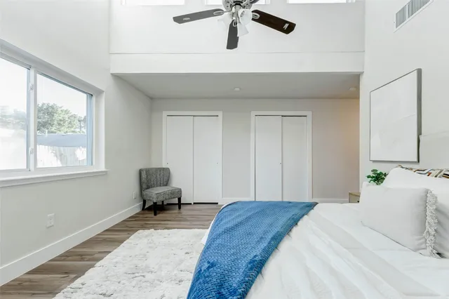 a bedroom with a bed and window