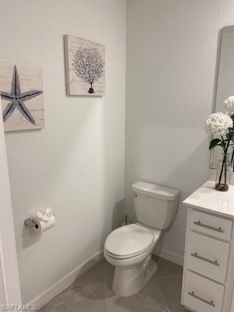 15275 Grn Acrs Avenue, Unit 337 Punta Gorda, FL 33982 - Photo 12 of 17 a white toilet sitting next to a bathroom sink