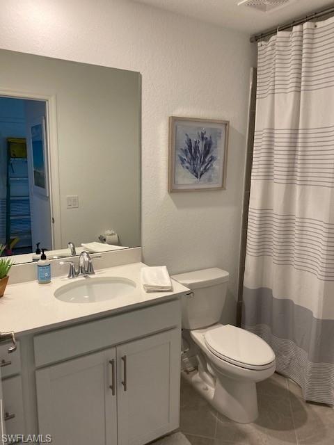 15275 Grn Acrs Avenue, Unit 337 Punta Gorda, FL 33982 - Photo 17 of 17 a bathroom with a sink a toilet and a mirror