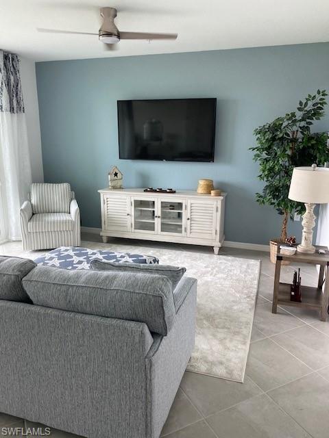 15275 Grn Acrs Avenue, Unit 337 Punta Gorda, FL 33982 - Photo 2 of 17 a living room with furniture and a flat screen tv