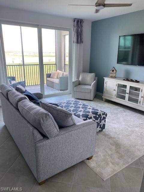 15275 Grn Acrs Avenue, Unit 337 Punta Gorda, FL 33982 - Photo 3 of 17 a living room with furniture and a flat screen tv