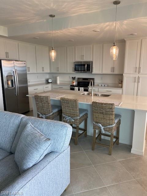 15275 Grn Acrs Avenue, Unit 337 Punta Gorda, FL 33982 - Photo 5 of 17 a living room with stainless steel appliances kitchen island granite countertop furniture and a view of kitchen