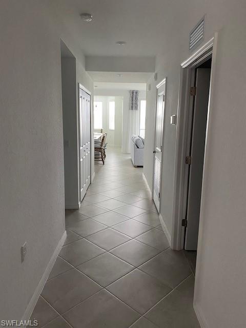 15275 Grn Acrs Avenue, Unit 337 Punta Gorda, FL 33982 - Photo 8 of 17 a hallway with a view of a bathroom