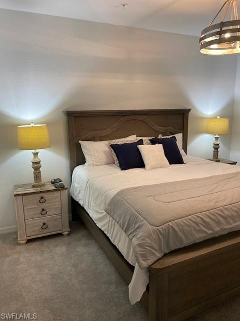 15275 Grn Acrs Avenue, Unit 337 Punta Gorda, FL 33982 - Photo 10 of 17 a bedroom with a bed and lamps