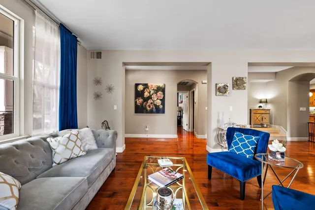 a living room with furniture and a large window