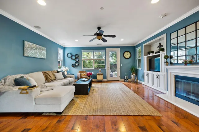 a living room with furniture and a fireplace