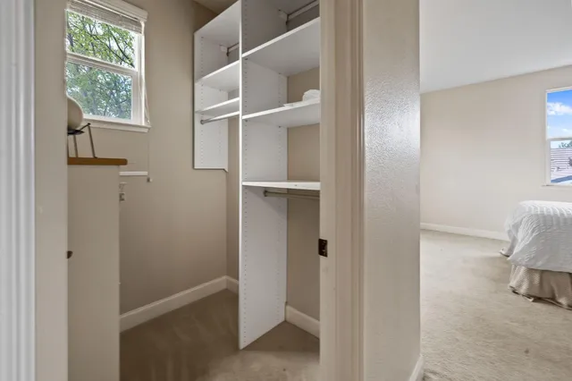 a view of walk in closet with window