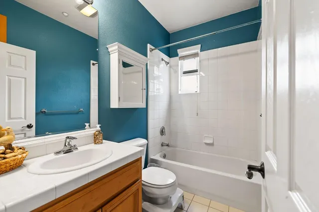 a bedroom with furniture and windows