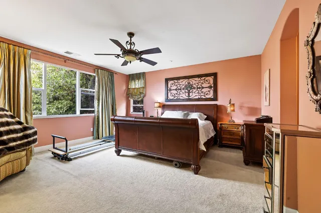 a bed room with a bed and a television