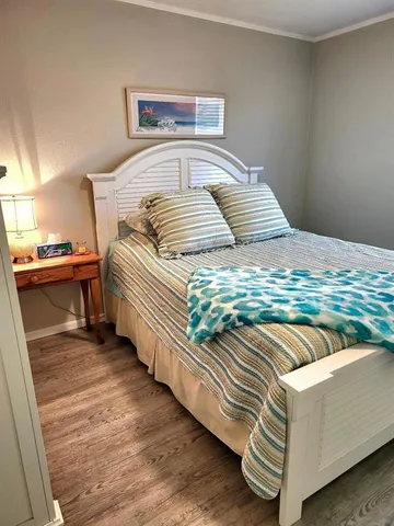 a bedroom with a bed and a dresser