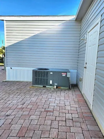 a view of a closet area with wooden floor