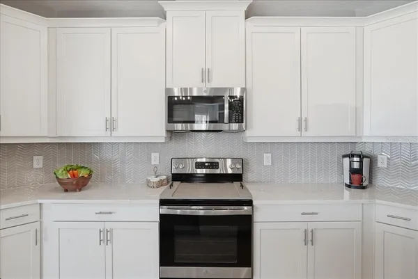 a bedroom with a bed and a night stand