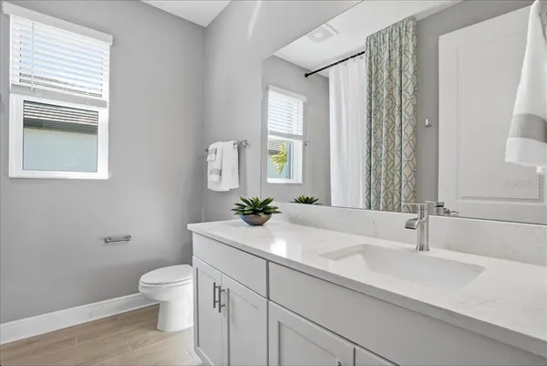 a view of a lake with houses in the background