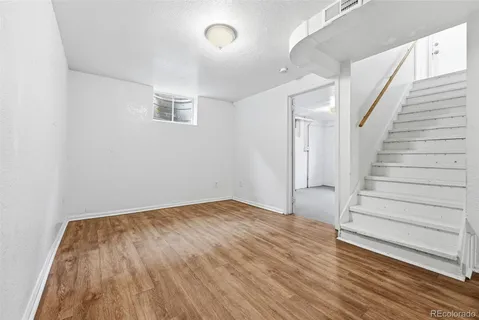a view of entryway with wooden floor