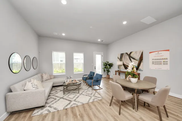 a living room with furniture a window and a table