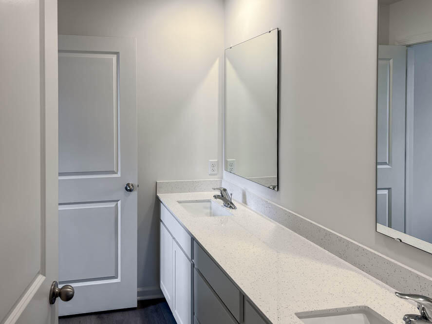7064 Fair Oaks Road Mount Pleasant, WI 53403 - Photo 10 of 40 Full bathroom on upper level with dual sinks and water closet