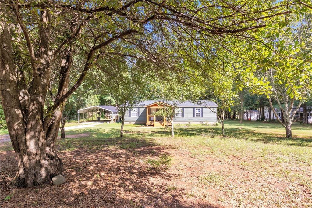 570 Jim David Road Nicholson, GA 30565 - Photo 1 of 1 a front view of a house with a yard