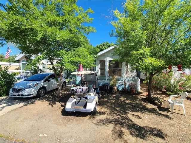 a couple of cars parked in front of a house