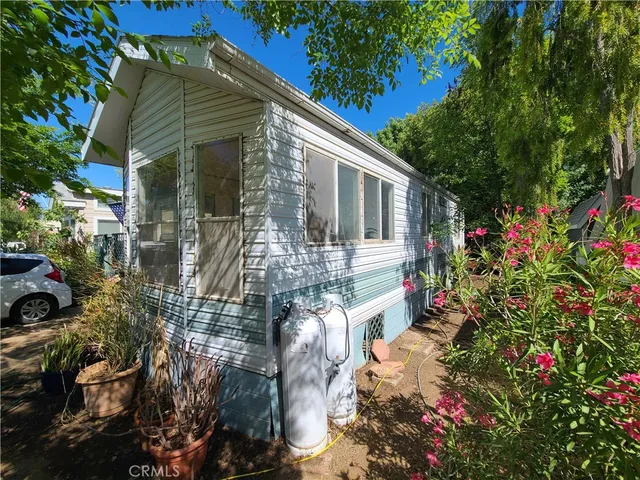a view of a house with a flower garden