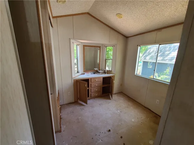 a view of a room with a sink and window