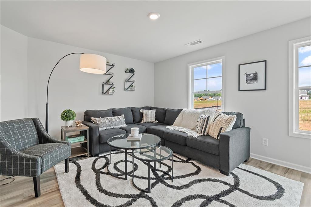 27 Cardinal Rdg Court Winder, GA 30680 - Photo 19 of 71 a living room with furniture and a wooden floor