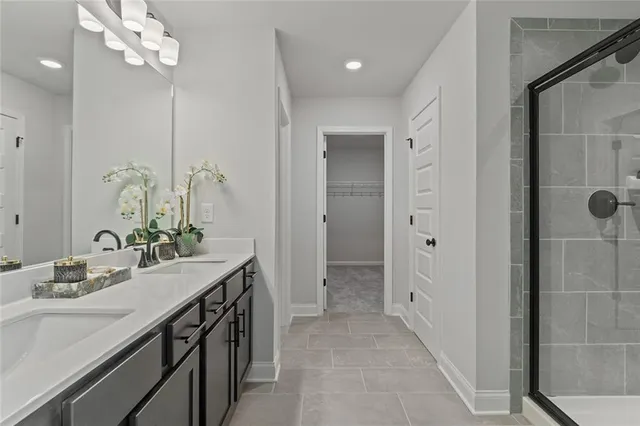 a bathroom with a glass shower door