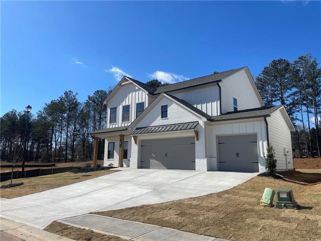 27 Cardinal Rdg Court Winder, GA 30680 - Photo 3 of 71 a view of a house with a yard and garage