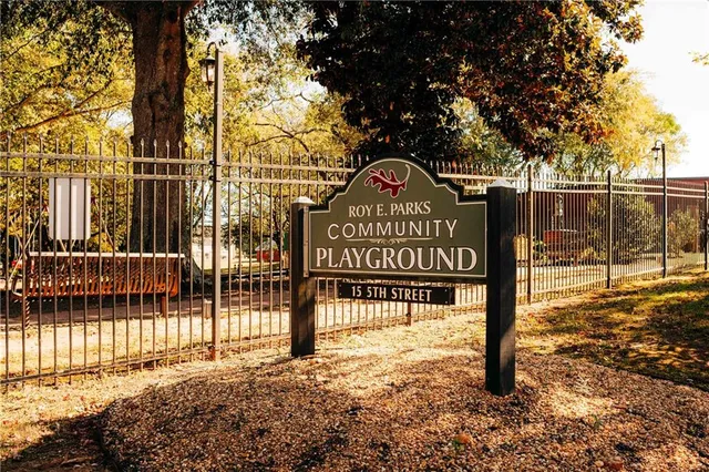 a view of a house with large trees