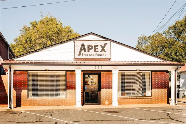 a view of a big building next to a road