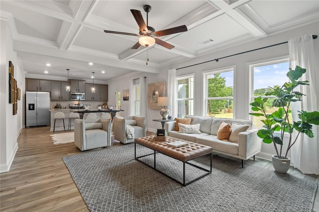27 Cardinal Rdg Court Winder, GA 30680 - Photo 7 of 71 a living room with furniture and a large window with kitchen view