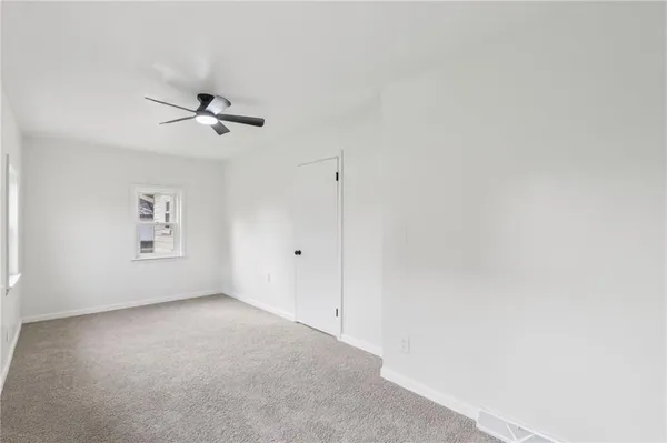 a view of a room with a wooden floor