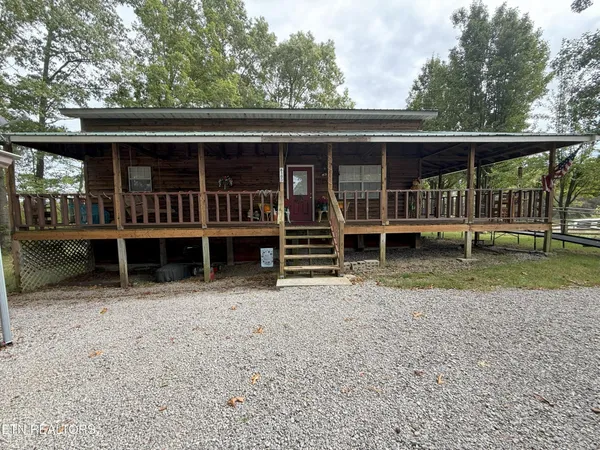 an outdoor view of house with backyard space