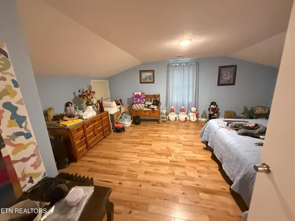 a bed room with a bed and a couch