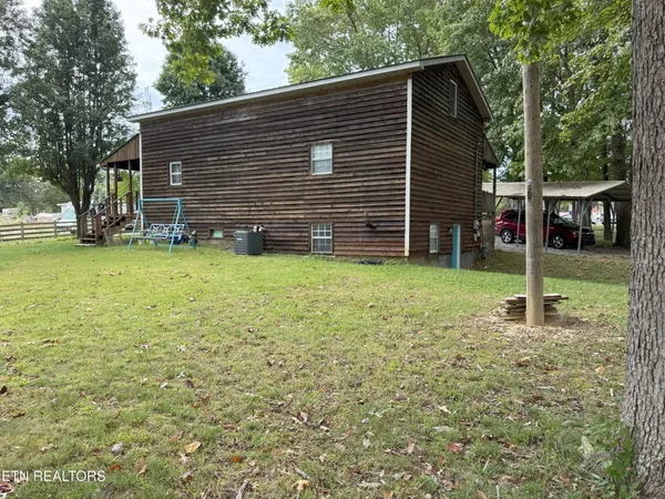 a view of a backyard with a cabin