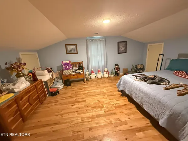 a bed room with a bed and a couch