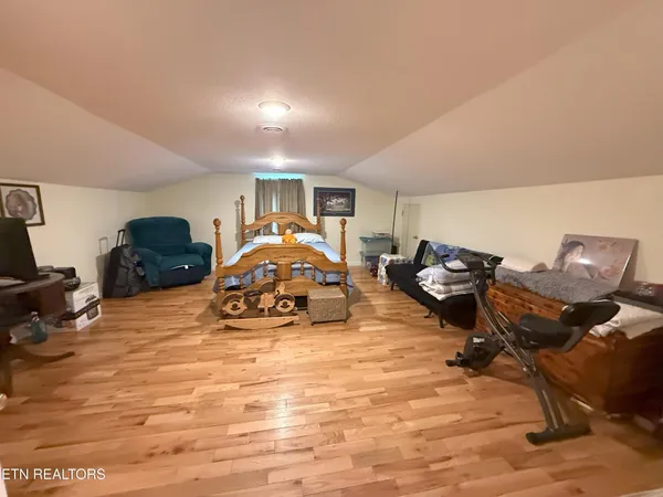 a living room with furniture a air conditioner vent and a window