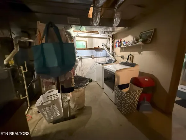 a room with water heater and storage