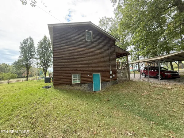 a view of a house with a back yard