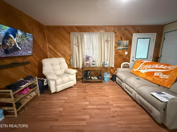 a living room with furniture and a large window