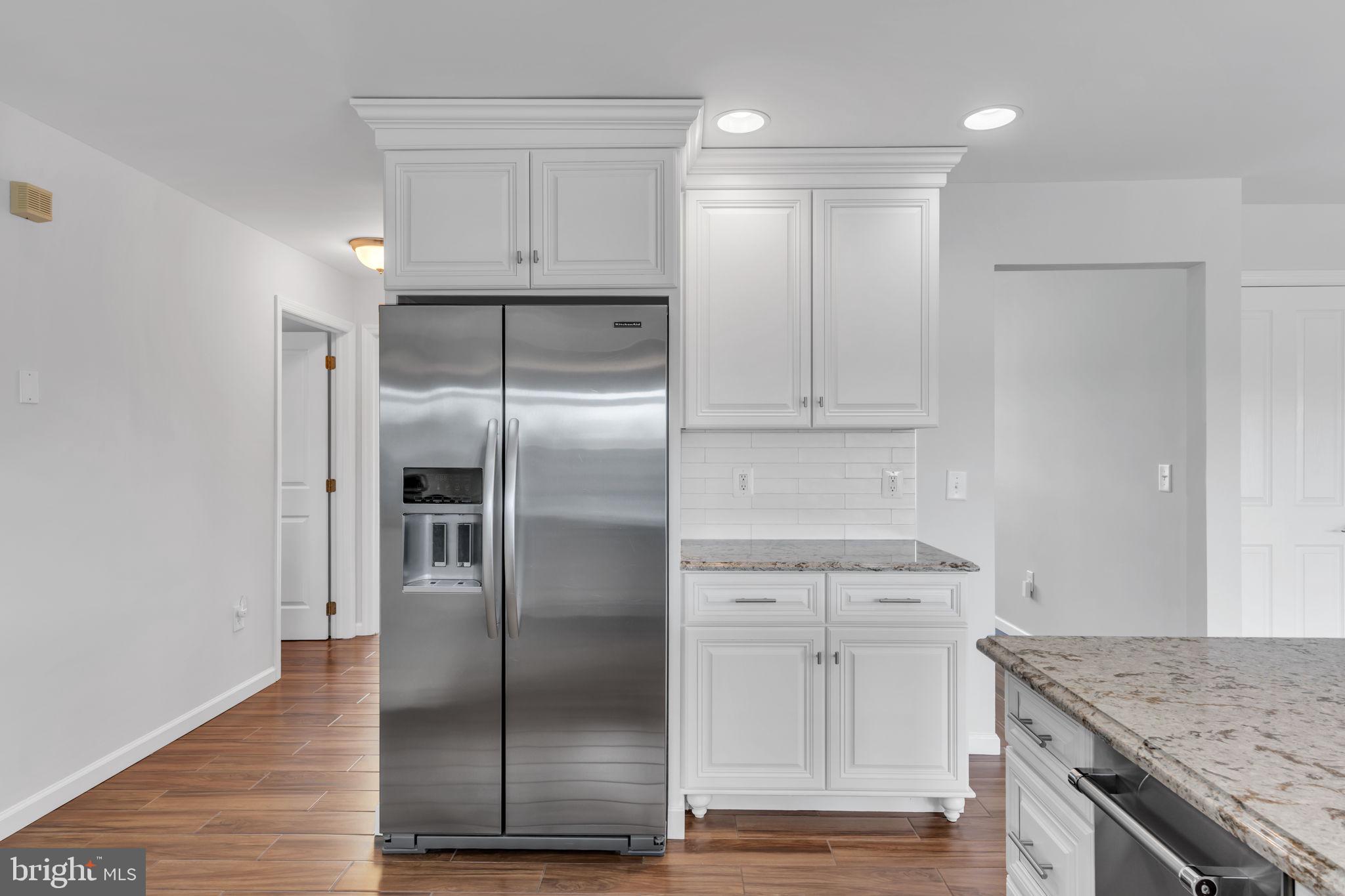 68 Morris Boulevard Manahawkin, NJ 08050 - Photo 14 of 43 a modern kitchen with stainless steel appliances granite countertop a refrigerator and a sink