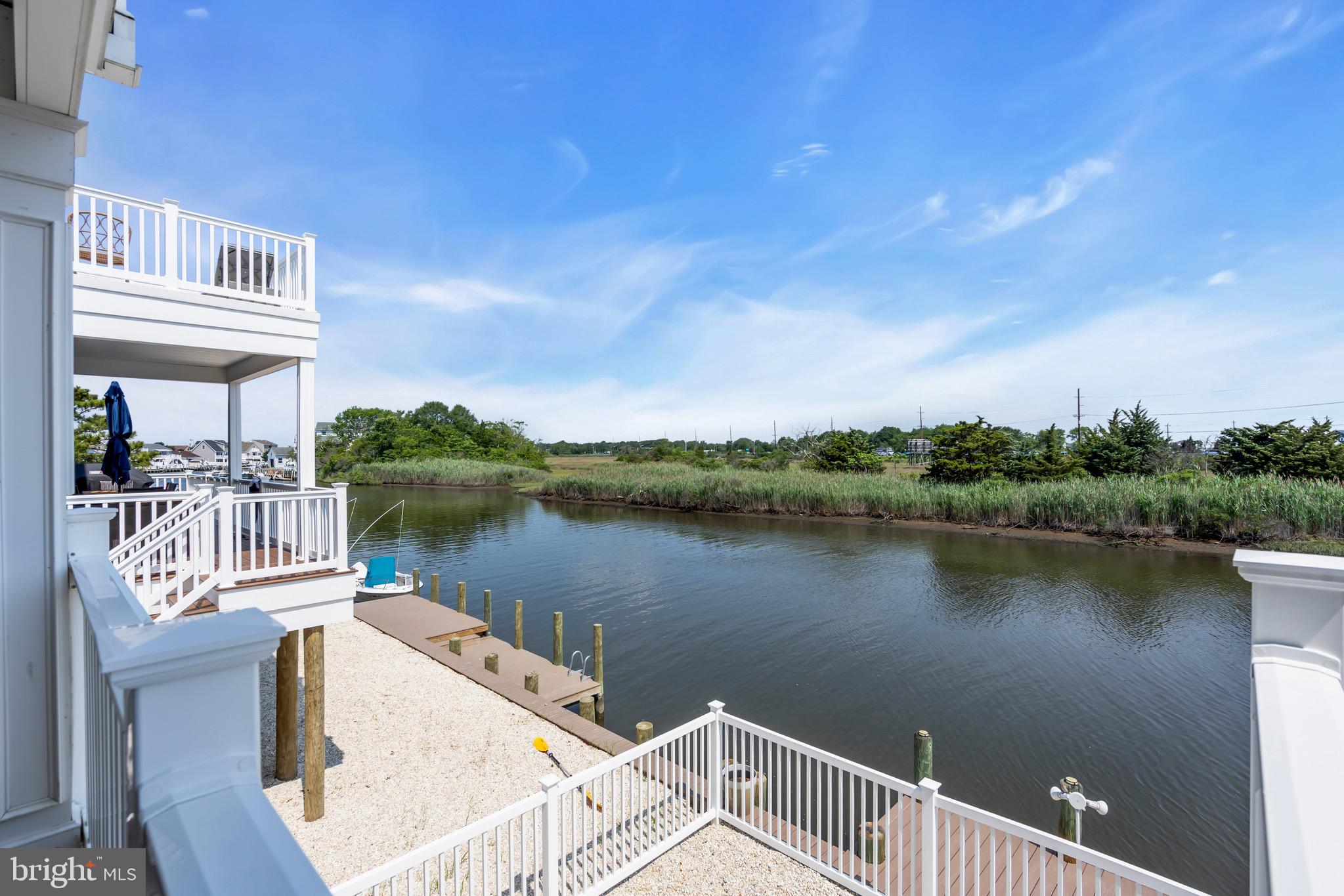 68 Morris Boulevard Manahawkin, NJ 08050 - Photo 17 of 43 a view of a lake with a deck