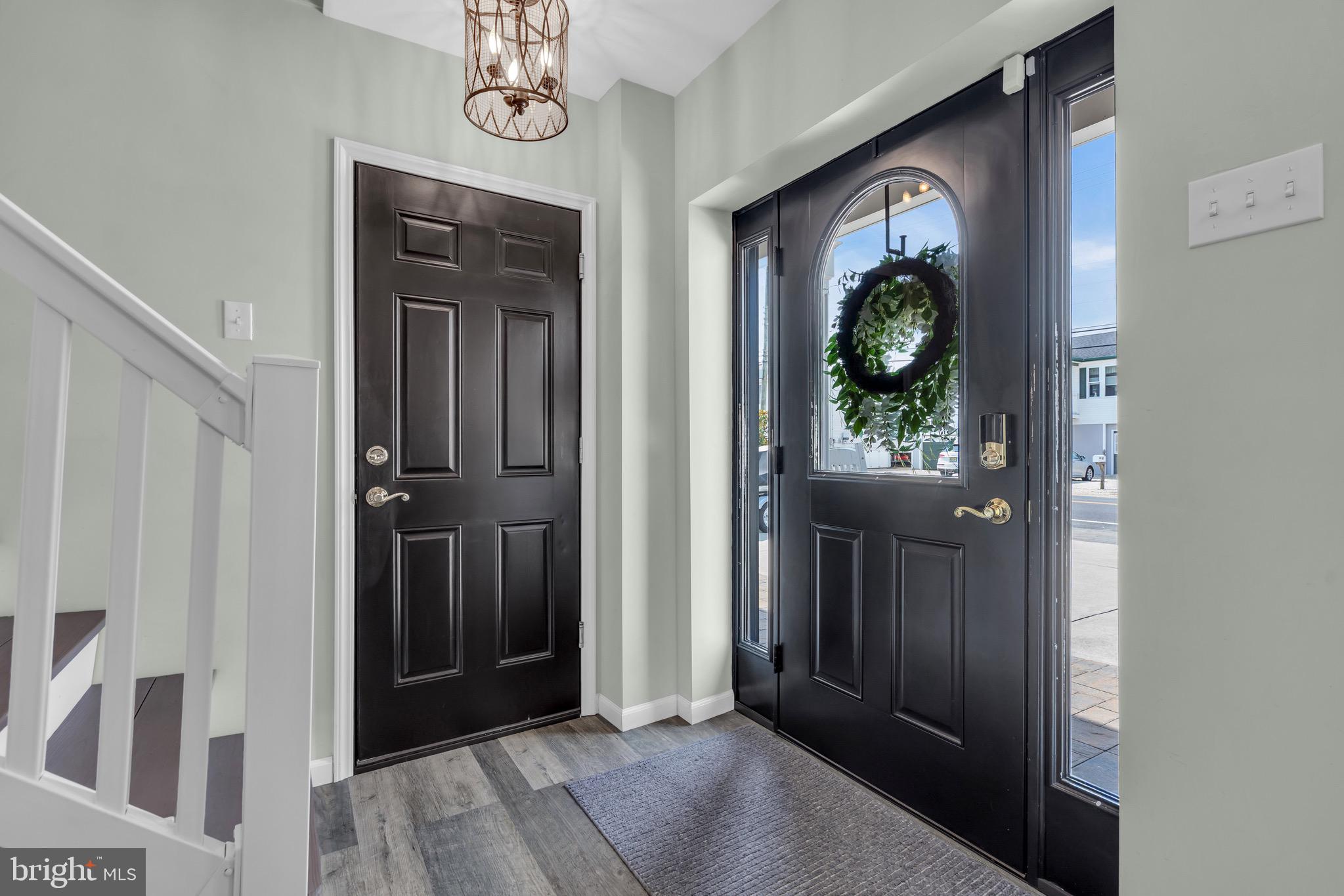 68 Morris Boulevard Manahawkin, NJ 08050 - Photo 2 of 43 a view of a hallway with wooden floor windows and entryway