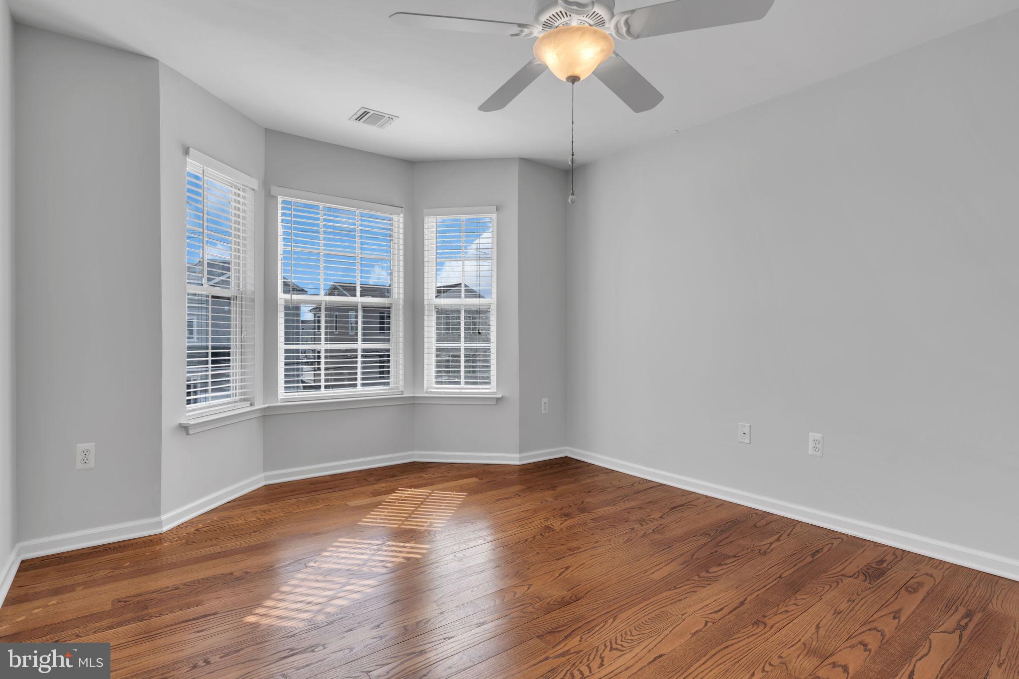 68 Morris Boulevard Manahawkin, NJ 08050 - Photo 23 of 43 wooden floor in an empty room with a window
