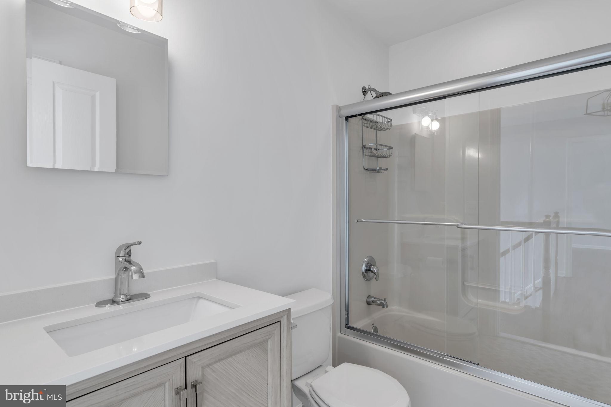 68 Morris Boulevard Manahawkin, NJ 08050 - Photo 24 of 43 a bathroom with a sink toilet and shower