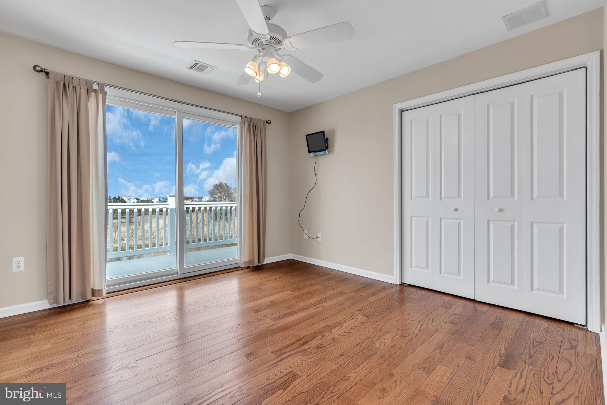 68 Morris Boulevard Manahawkin, NJ 08050 - Photo 25 of 43 a view of an empty room with wooden floor and a window