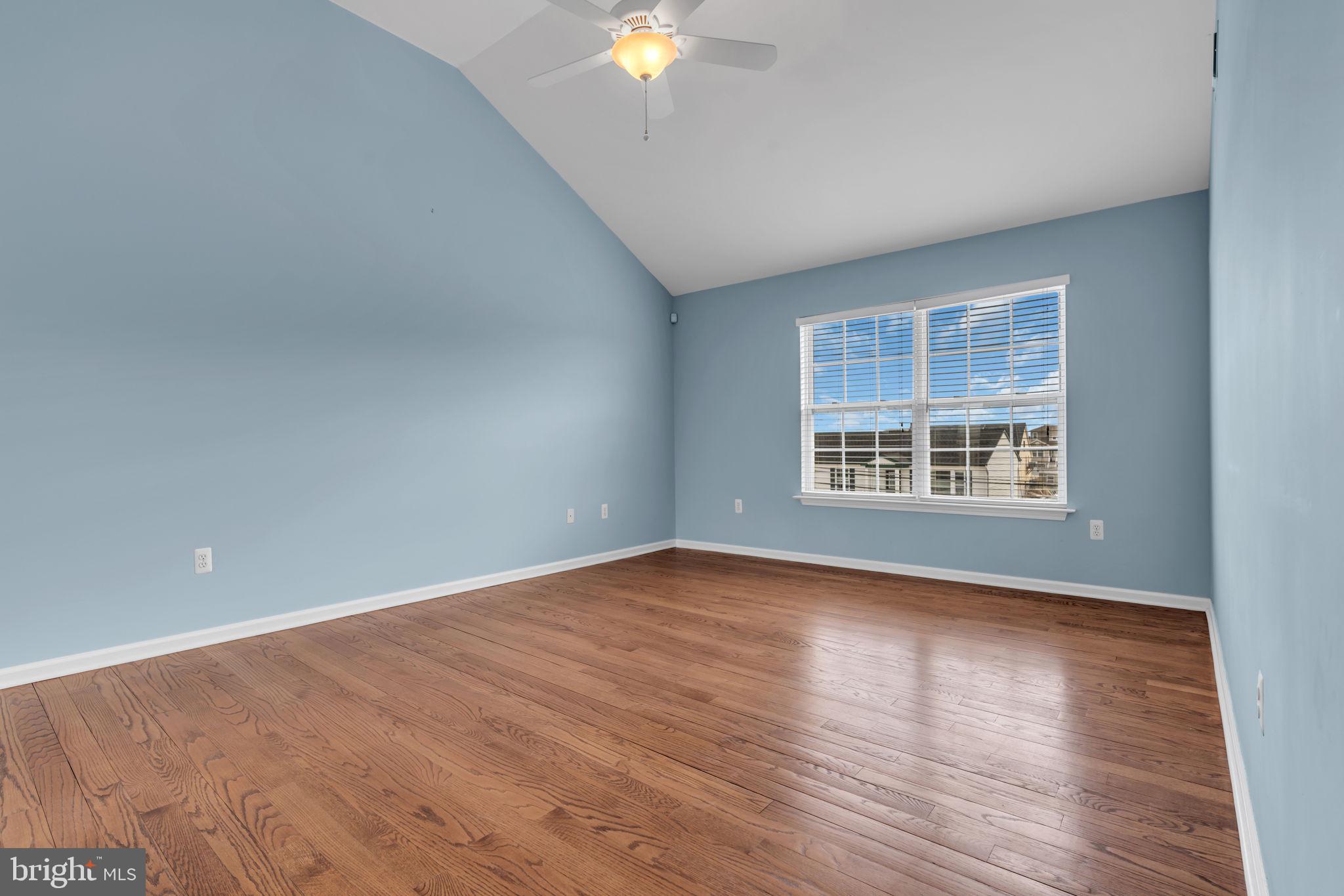 68 Morris Boulevard Manahawkin, NJ 08050 - Photo 27 of 43 an empty room with wooden floor and windows