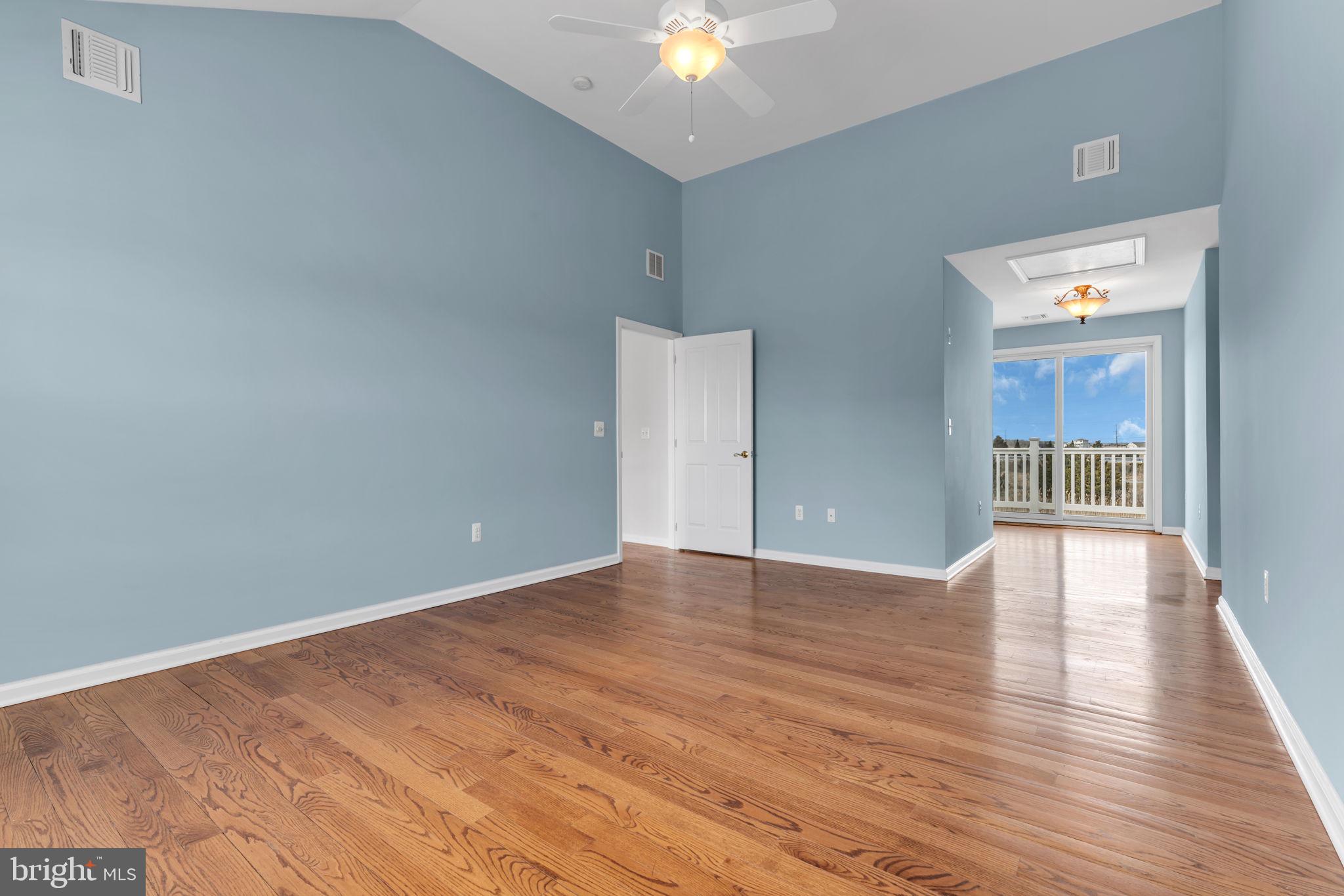 68 Morris Boulevard Manahawkin, NJ 08050 - Photo 28 of 43 a view of an empty room with wooden floor and a ceiling fan