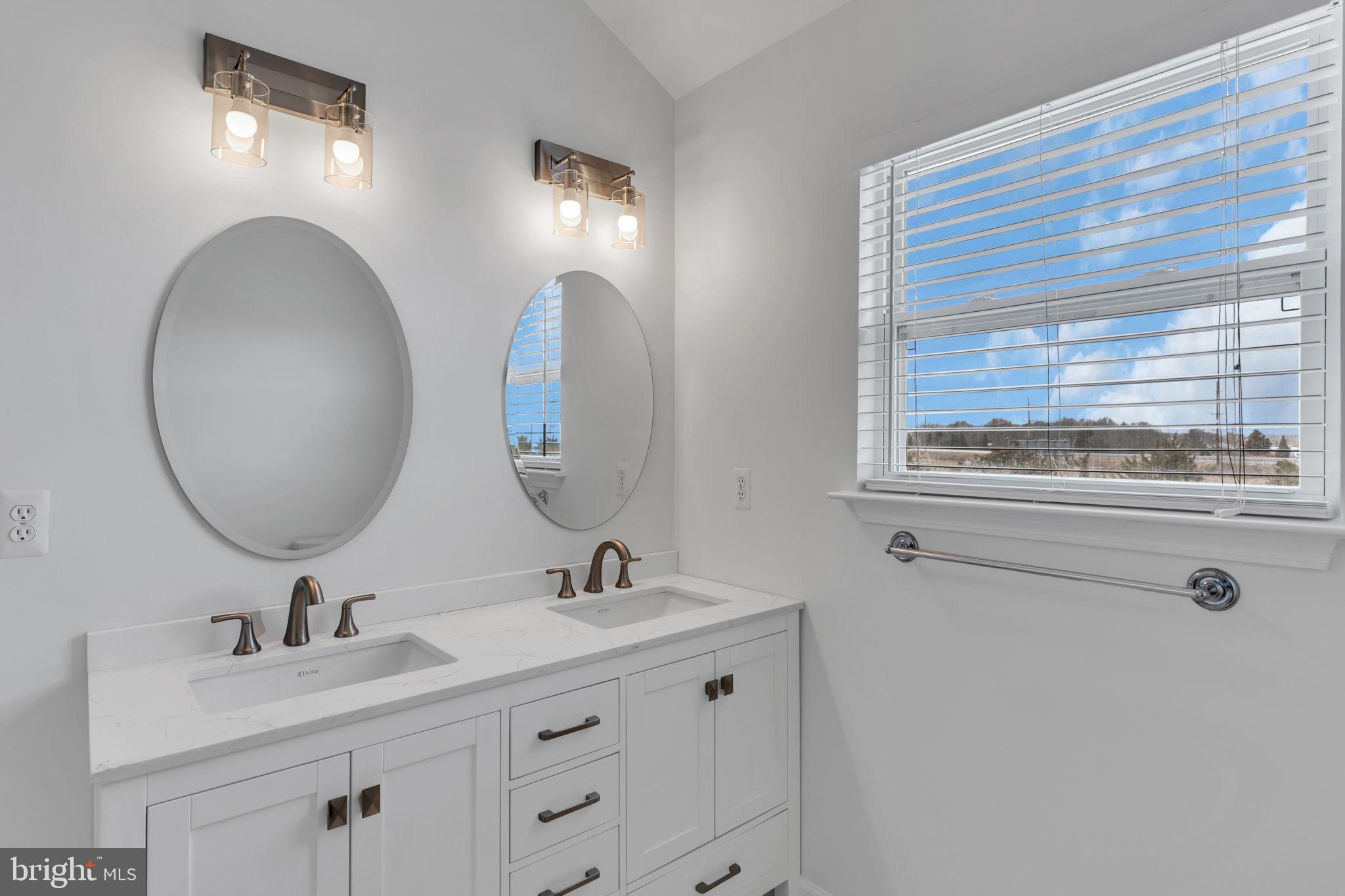 68 Morris Boulevard Manahawkin, NJ 08050 - Photo 31 of 43 a bathroom with a sink and a mirror