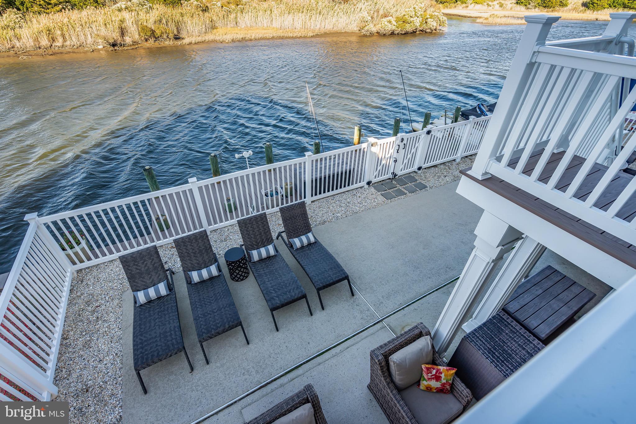 68 Morris Boulevard Manahawkin, NJ 08050 - Photo 33 of 43 a view of roof deck with lawn chairs next to an ocean